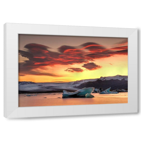 Icebergs from the Jokulsarlon glacier adrift in sunset in Jokulsarlon lagoon in Iceland White Modern Wood Framed Art Print by Steve Mohlenkamp