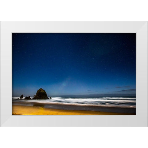 USA- Oregon. Cannon Beach and Haystack Rock stars showing during blue light. White Modern Wood Framed Art Print by Gulin, Darrell