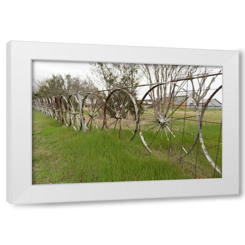 A fence made of wagon wheels near Schulenburg in Fayette County, TX White Modern Wood Framed Art Print by Highmith, Carol