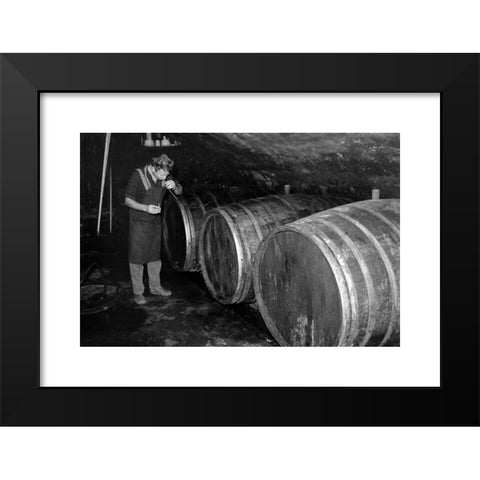 1960's Image Collection by United Archives GmbH - Black Modern Wood Framed Art Print Titled: Winzer bei der Weinprobe in einem Weinkeller in KrÃ¶v, Deutschland 1968. Winegrower checking his product at his wine cellar in Kroev, Germany 1968.