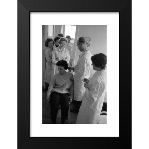 1960's Image Collection by Sueddeutsche Zeitung Photo - Black Modern Wood Framed Art Print Titled: Employees of the Ravensberg Chemische Fabrik, manufacturer of a new vaccine against influenza, are vaccinated with the compound.