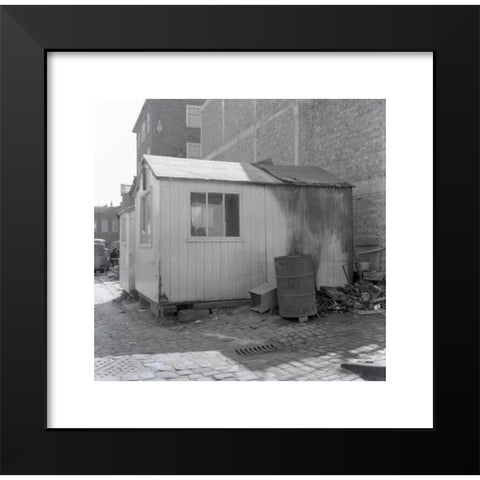 1960's Image Collection by Allan Cash Picture Library - Black Modern Wood Framed Art Print Titled: 1960s, historical, side-view of a workman's wooden hut, with windows, stacked on bricks on a cobbled area, England, UK. Outside a metal barre
