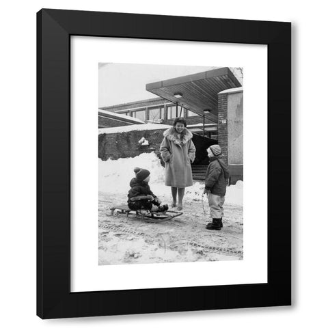 1960's Image Collection by NTB - Black Modern Wood Framed Art Print Titled: Oslo 1960s. Harriet Holter talks to two children outside the Department of Social Research Munthes gate 31. Snow. 1960s. Photo: NTB