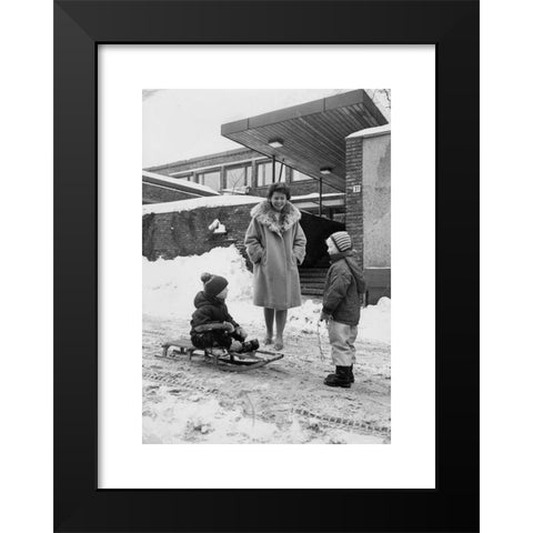 1960's Image Collection by NTB - Black Modern Wood Framed Art Print Titled: Oslo 1960s. Harriet Holter talks to two children outside the Department of Social Research Munthes gate 31. Snow. 1960s. Photo: NTB