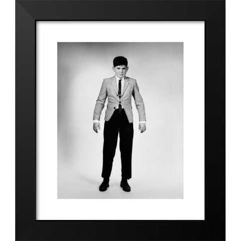 1960's Image Collection by ClassicStock - Black Modern Wood Framed Art Print Titled: 1950s 1960s OVERGROWN BOY IN TOO TIGHT SPORTS JACKET AND PANTS LOOKING AT CAMERA