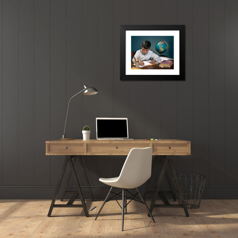 1960's Image Collection by ClassicStock - Black Modern Wood Framed Art Print Titled: 1960s 1970s BOY DOING HOMEWORK AT DESK WRITING NOTEBOOK BOOKS GLOBE