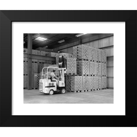 1960's Image Collection by ClassicStock - Black Modern Wood Framed Art Print Titled: 1960s WAREHOUSE MAN DRIVING FORKLIFT IN INSTANT COFFEE PLANT