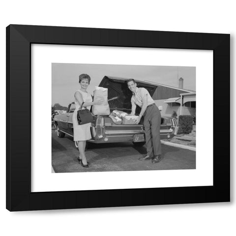 1960's Image Collection by ClassicStock - Black Modern Wood Framed Art Print Titled: 1960s COUPLE UNPACKING GROCERY BAGS FROM AUTOMOBILE TRUNK