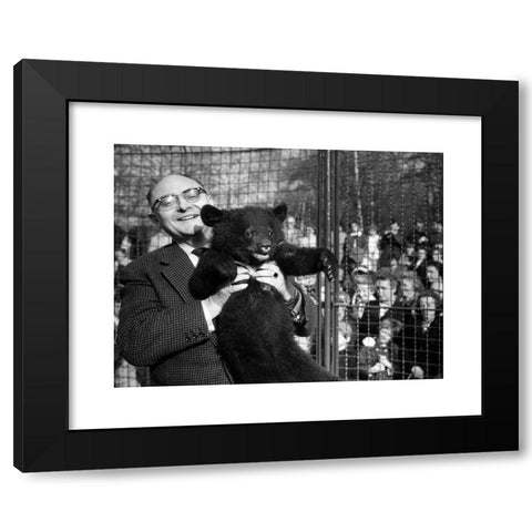 1960's Image Collection by INTERFOTO - Black Modern Wood Framed Art Print Titled: Dathe, Heinrich, 7.11.1910 - 6.1.1991, German zoologist, director of the zoo in Berlin Friedrichsfelde 1954 - 1990, half length, with young bear, 30.4.1963,