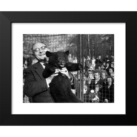 1960's Image Collection by INTERFOTO - Black Modern Wood Framed Art Print Titled: Dathe, Heinrich, 7.11.1910 - 6.1.1991, German zoologist, director of the zoo in Berlin Friedrichsfelde 1954 - 1990, half length, with young bear, 30.4.1963,