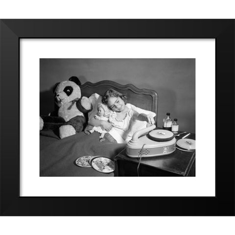 1960's Image Collection by ClassicStock - Black Modern Wood Framed Art Print Titled: 1950s SICK LITTLE GIRL IN BED PLAYING WITH RECORD PLAYER