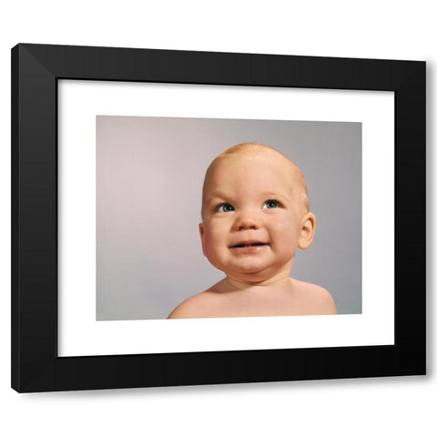 1960's Image Collection by ClassicStock - Black Modern Wood Framed Art Print Titled: 1960s 1970s BABY PORTRAIT WITH EYES LOOKING TO SIDE WITH SLY DUBIOUS FACIAL EXPRESSION