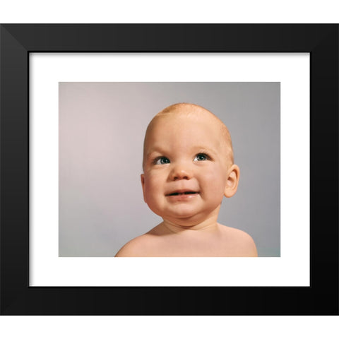 1960's Image Collection by ClassicStock - Black Modern Wood Framed Art Print Titled: 1960s 1970s BABY PORTRAIT WITH EYES LOOKING TO SIDE WITH SLY DUBIOUS FACIAL EXPRESSION