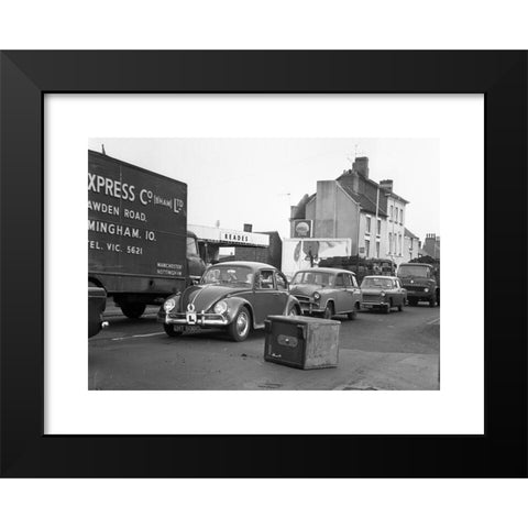 1960's Image Collection by Black Country Images - Black Modern Wood Framed Art Print Titled: Motorists avoiding a Chubb security safe which has fallen from a lorry Britain 1960s daylight robbery