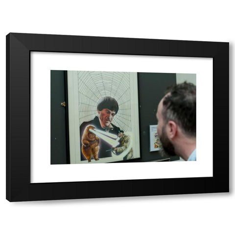 1960's Image Collection by Stephen Chung - Black Modern Wood Framed Art Print Titled: London, UK. 4 May 2016. A visitor views 'The Web of Fear' (1976), by the artist Chris Achilleos. Doctor Who: The Target Books Artwork exhibition, currentl