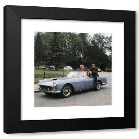 1960's Image Collection by Photo 12 - Black Modern Wood Framed Art Print Titled: French singers Johnny Hallyday and Sylvie Vartan posing in the new Ferrari car bought by Johnny a couple of days ago. 1963