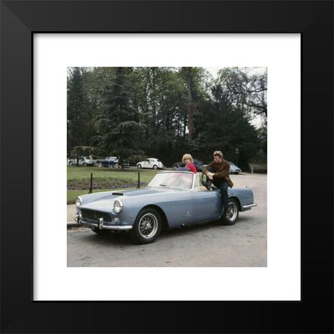 1960's Image Collection by Photo 12 - Black Modern Wood Framed Art Print Titled: French singers Johnny Hallyday and Sylvie Vartan posing in the new Ferrari car bought by Johnny a couple of days ago. 1963