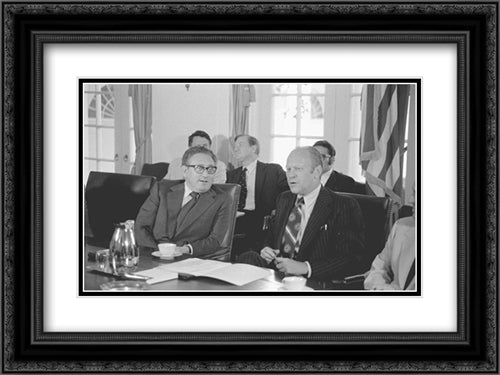 Secretary of State Henry Kissinger and President Gerald Ford seated at a conference table in the White House, during a cabinet meeting 24x18 Black Ornate Wood Framed Art Print Poster with Double Matting by Library of Congress