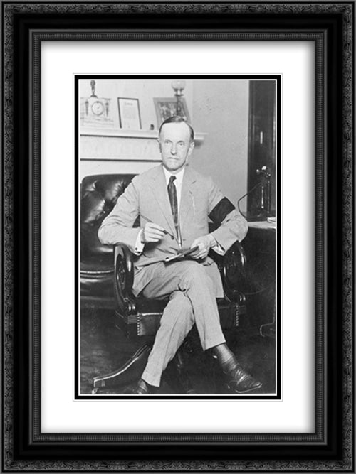 Calvin Coolidge, full-length portrait, seated at desk, facing front, holding pen and paper, wearing black armband in mourning for President Harding 18x24 Black Ornate Wood Framed Art Print Poster with Double Matting by Library of Congress
