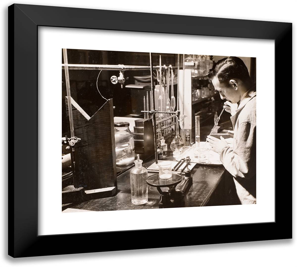 Man in a Lab Uses Both Hands to Place a Large Pipette Into 22x20 Black Modern Wood Framed Art Print Poster by Eagle, Arnold