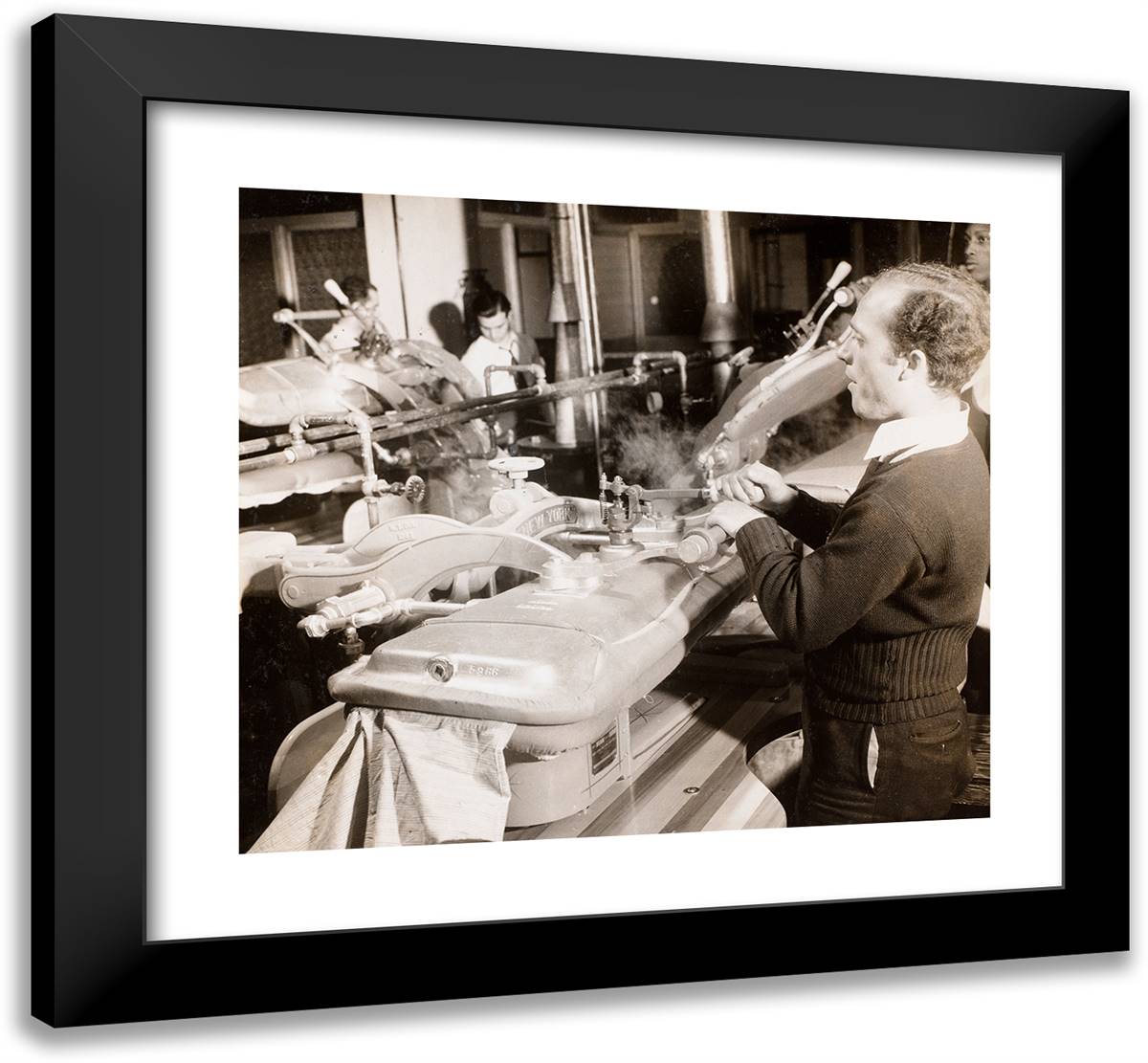 Man Uses a Machine to Press Dresses 22x20 Black Modern Wood Framed Art Print Poster by Eagle, Arnold