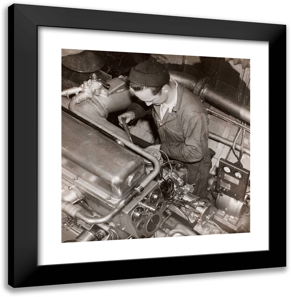 Man Wearing a Knit Cap Works on an Engine 20x20 Black Modern Wood Framed Art Print Poster by Eagle, Arnold