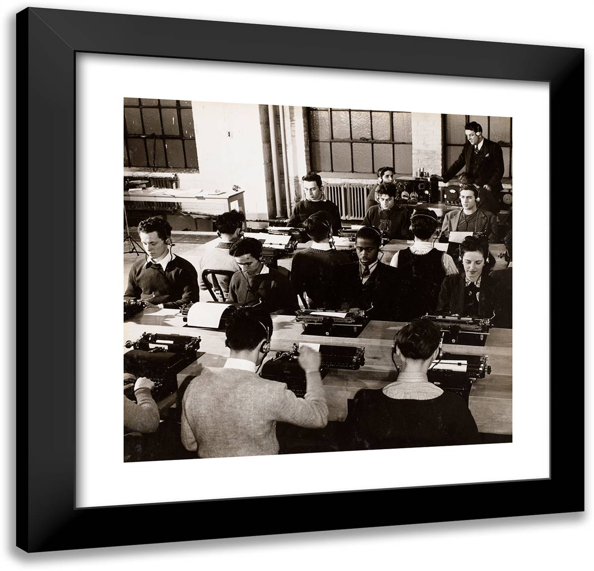 People Sit in Front of Typewriters While Wearing Headphones 21x20 Black Modern Wood Framed Art Print Poster by Eagle, Arnold