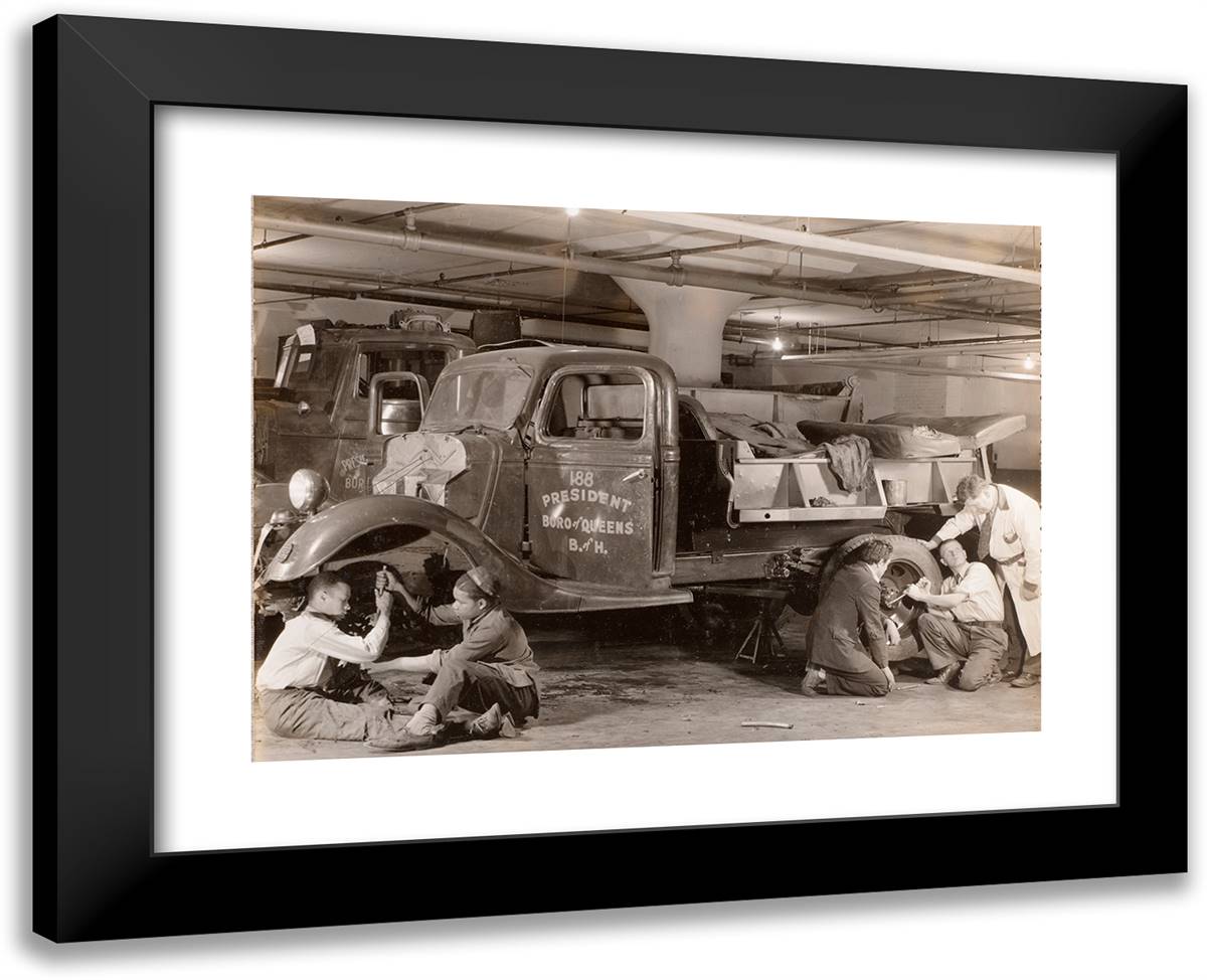 Two Groups of Young Men Work on the Wheels of a Truck 24x19 Black Modern Wood Framed Art Print Poster by Eagle, Arnold