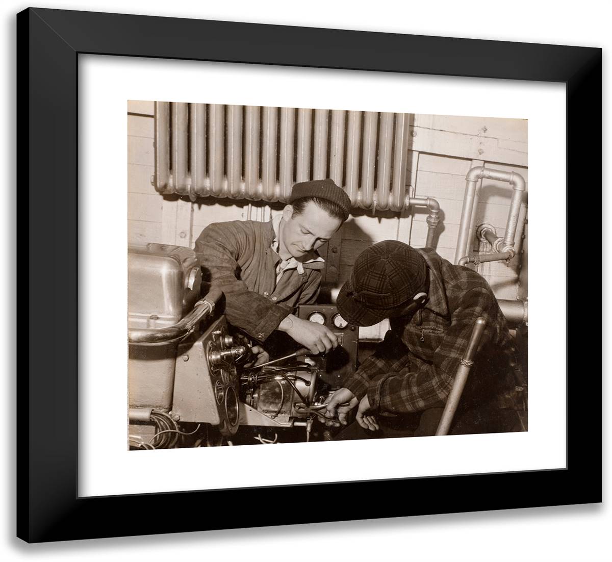 Two Men Work on a Machine Using a Screwdriver and a Wrench 22x20 Black Modern Wood Framed Art Print Poster by Eagle, Arnold