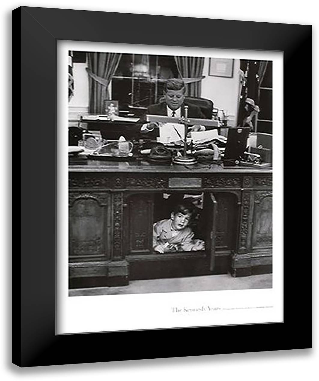 John Jr. Playing under JFKs Desk, 1963 22x28 Black Modern Wood Framed Art Print Poster by Tretick, Stanley