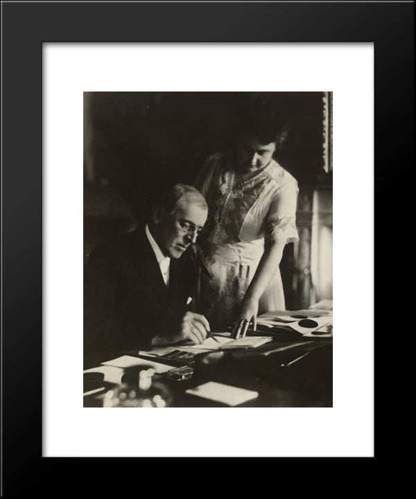 President Woodrow Wilson, Seated At Desk With His Wife, Edith Bolling Galt, Standing At His Side 20x24 Black Modern Wood Framed Art Print Poster by Library of Congress
