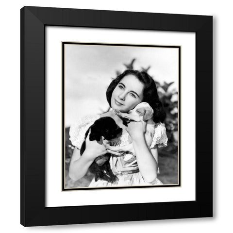 Elizabeth Taylor with puppies Black Modern Wood Framed Art Print with Double Matting by Hollywood Photo Archive
