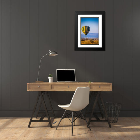 A hot-air balloon slowly traverses over the Serengeti plain Black Modern Wood Framed Art Print with Double Matting by Richardson, Larry