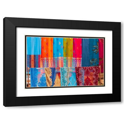 Laos- Luang Prabang. Colorful textiles- possibly scarves- for sale. Black Modern Wood Framed Art Print with Double Matting by Haseltine, Tom