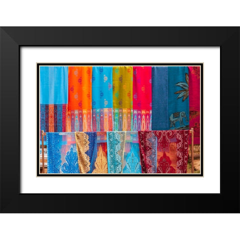 Laos- Luang Prabang. Colorful textiles- possibly scarves- for sale. Black Modern Wood Framed Art Print with Double Matting by Haseltine, Tom