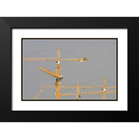 UAE, Dubai, Marina Yellow construction cranes Black Modern Wood Framed Art Print with Double Matting by Young, Bill
