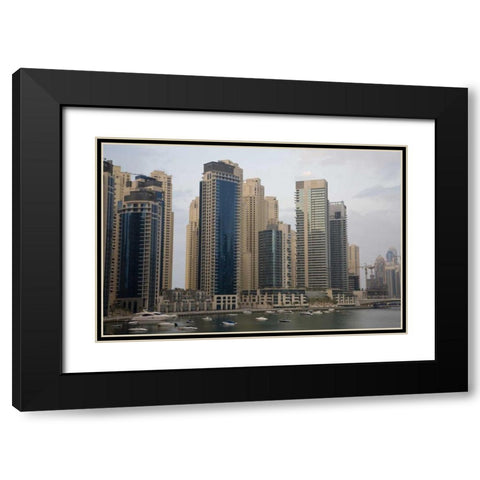 UAE, Dubai Modern buildings tower over boats Black Modern Wood Framed Art Print with Double Matting by Young, Bill