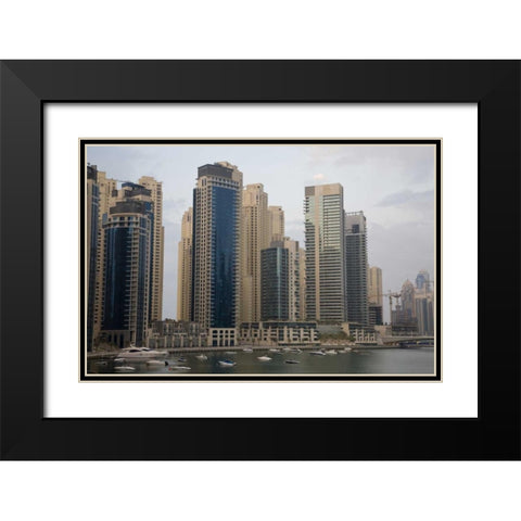 UAE, Dubai Modern buildings tower over boats Black Modern Wood Framed Art Print with Double Matting by Young, Bill