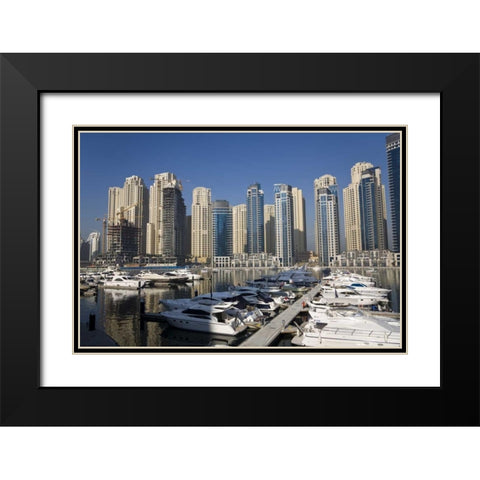 UAE, Dubai Marina towers with boats at anchor Black Modern Wood Framed Art Print with Double Matting by Young, Bill