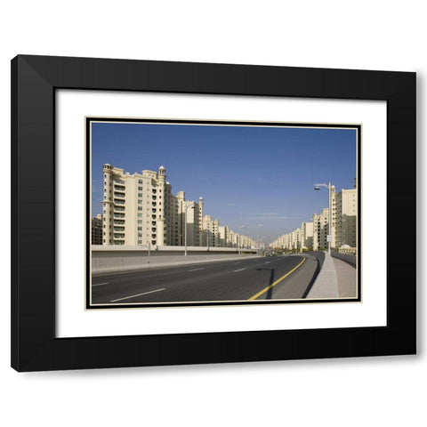 UAE, Dubai Road into the Palm Jumeirah Black Modern Wood Framed Art Print with Double Matting by Young, Bill