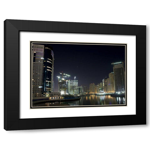 UAE, Dubai Towers on marina at night Black Modern Wood Framed Art Print with Double Matting by Young, Bill