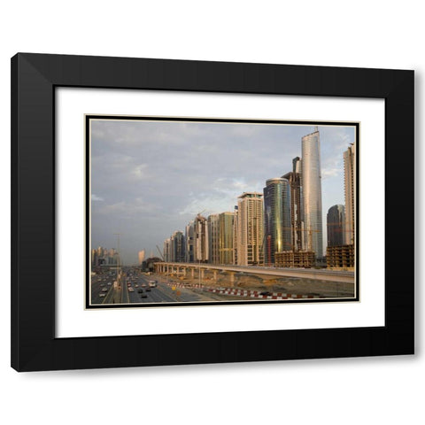 UAE, Dubai Jumeirah Lake Towers beside a Road Black Modern Wood Framed Art Print with Double Matting by Young, Bill