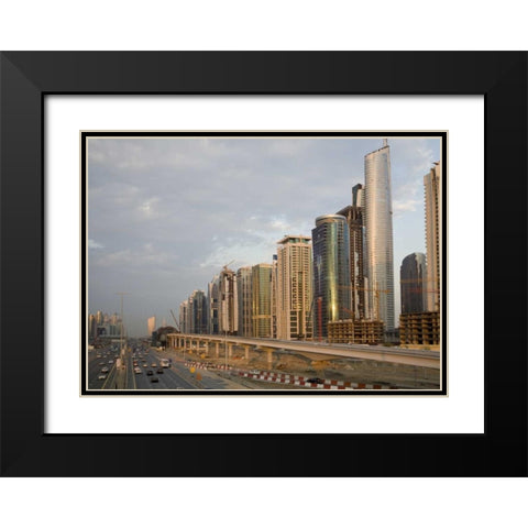 UAE, Dubai Jumeirah Lake Towers beside a Road Black Modern Wood Framed Art Print with Double Matting by Young, Bill
