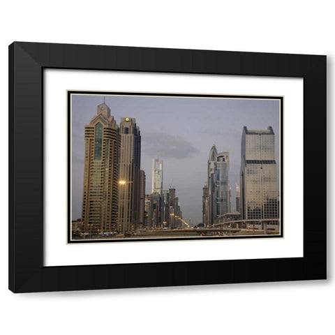 UAE, Dubai Towers along Sheik Zayed Road Black Modern Wood Framed Art Print with Double Matting by Young, Bill