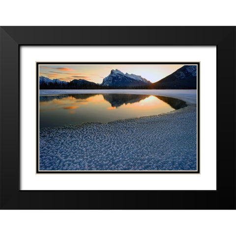 Snow crystals rim a lone break in the ice on Vermilion Lakes on a cold Banff National Park winter mo Black Modern Wood Framed Art Print with Double Matting by Steve Mohlenkamp