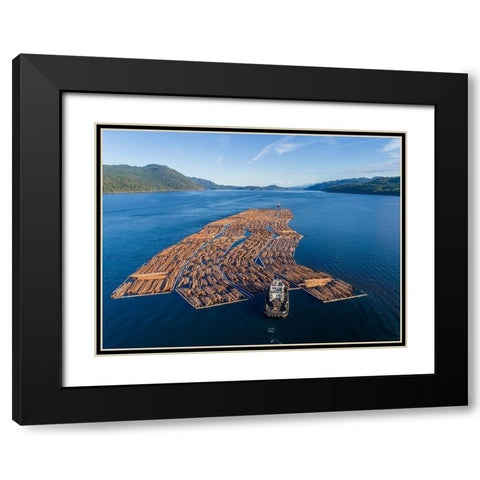Canada-British Columbia-Campbell River-Aerial view of tugboat pushing boom of freshly cut logs Black Modern Wood Framed Art Print with Double Matting by Souders, Paul