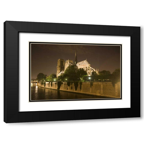 France, Paris Notre Dame Cathedral lit at night Black Modern Wood Framed Art Print with Double Matting by Zuckerman, Jim