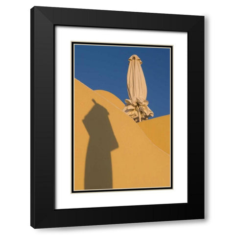 Greece, Santorini Sun umbrella against a wall Black Modern Wood Framed Art Print with Double Matting by Young, Bill