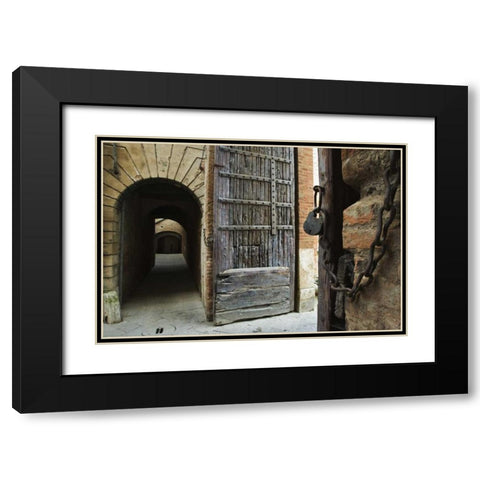 Italy, Tuscany, Fortified gate and an alley Black Modern Wood Framed Art Print with Double Matting by Flaherty, Dennis