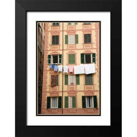 Italy, Camogli Laundry hangs across a building Black Modern Wood Framed Art Print with Double Matting by Kaveney, Wendy